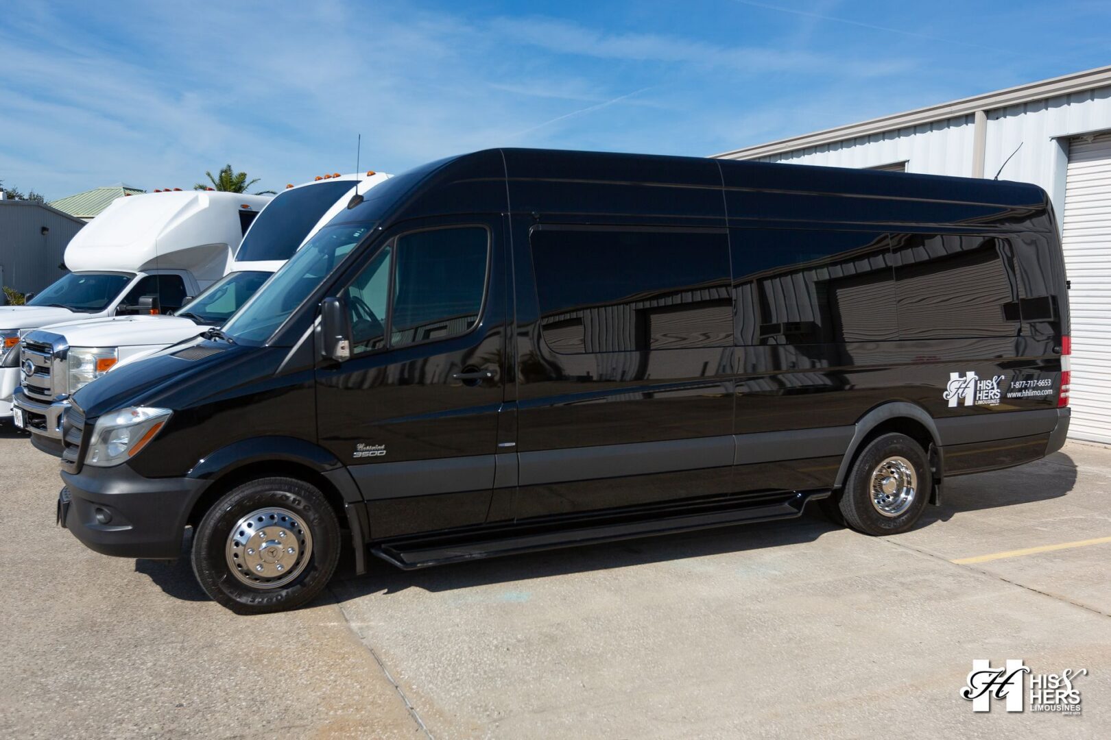 Black van parked outside a building