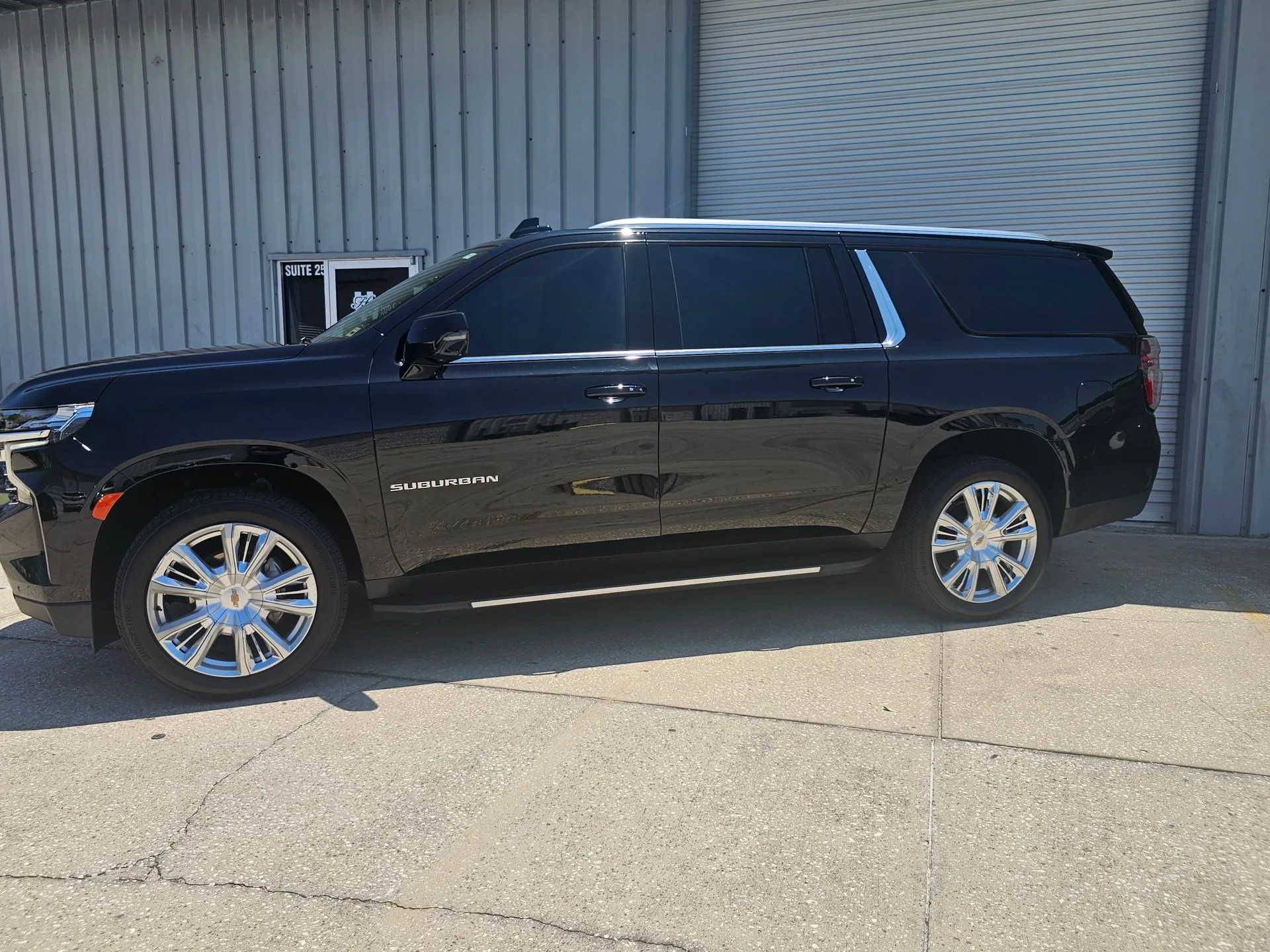 Large black SUV on sunny day