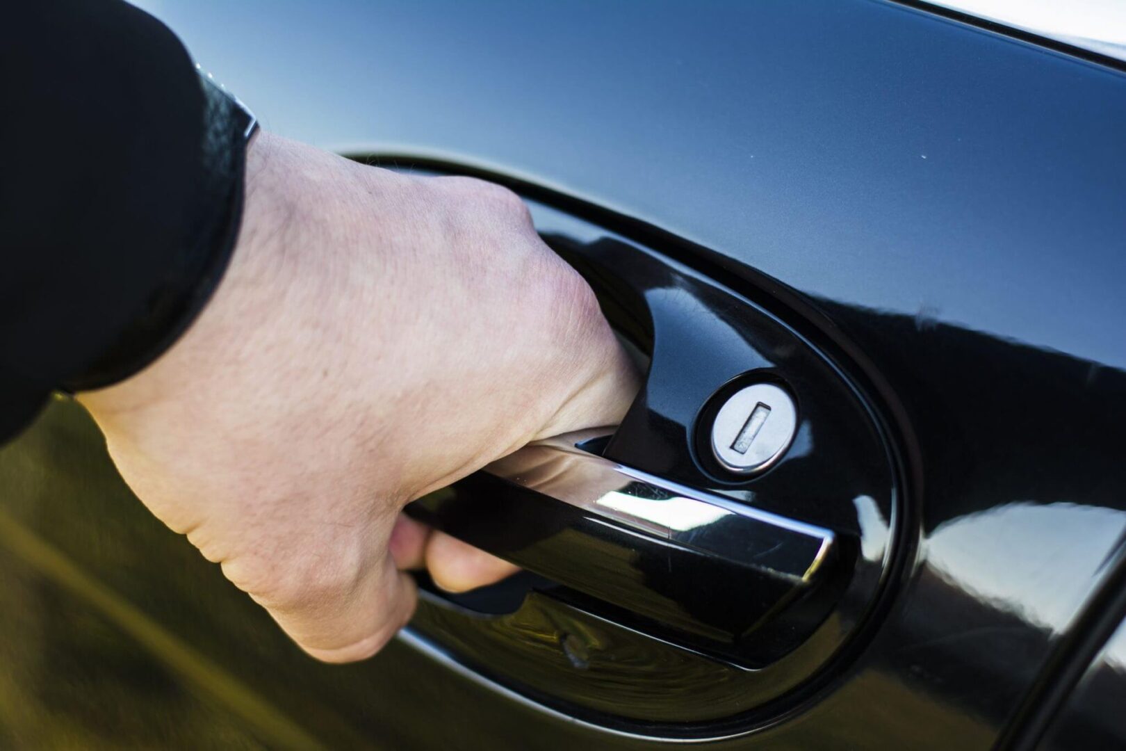 Black car door being opened