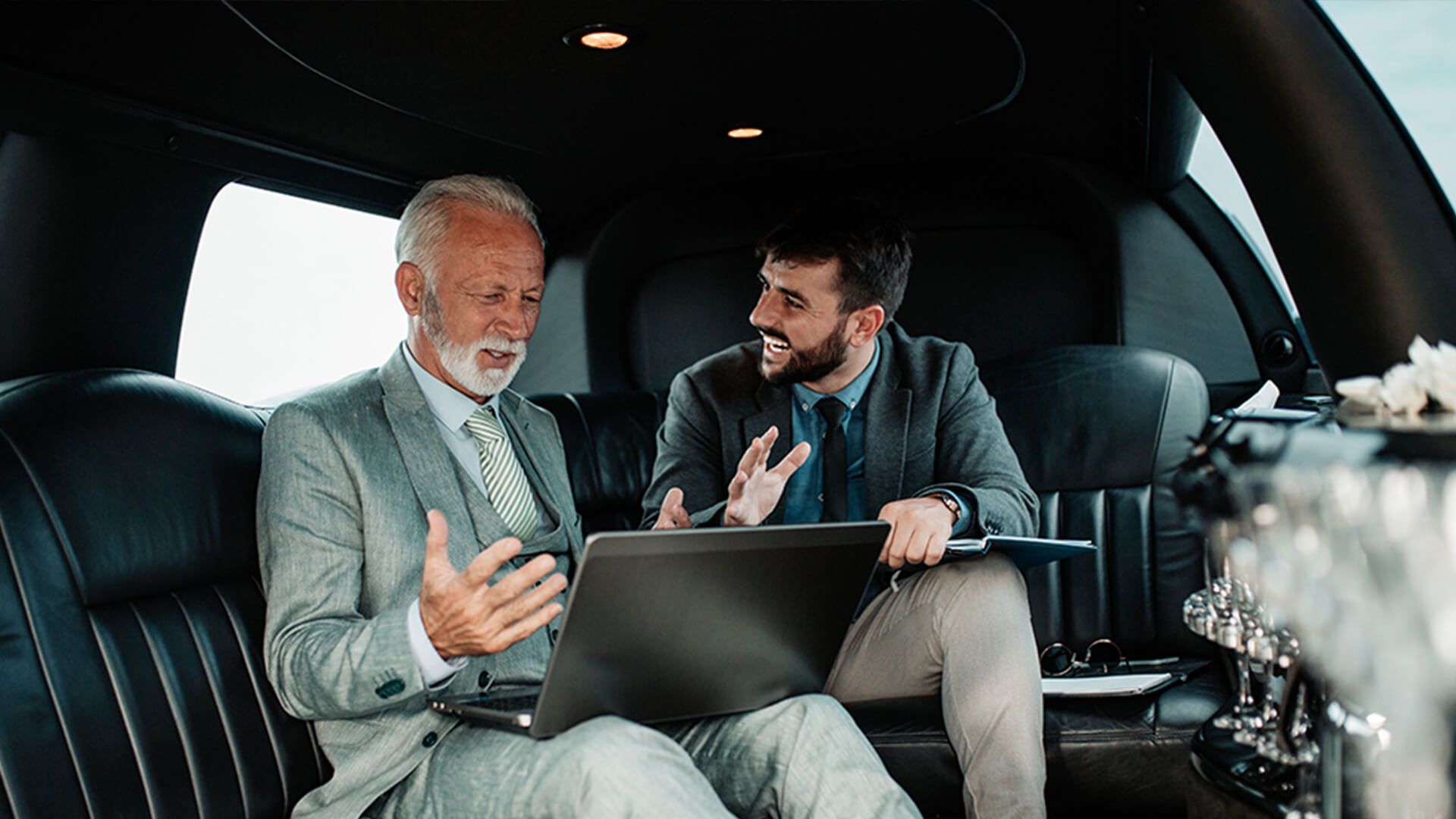 Colleagues having a conversation in vehicle