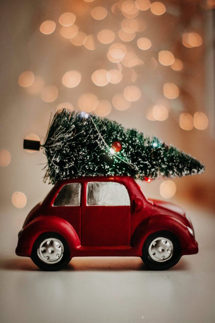Red toy car with Christmas tree