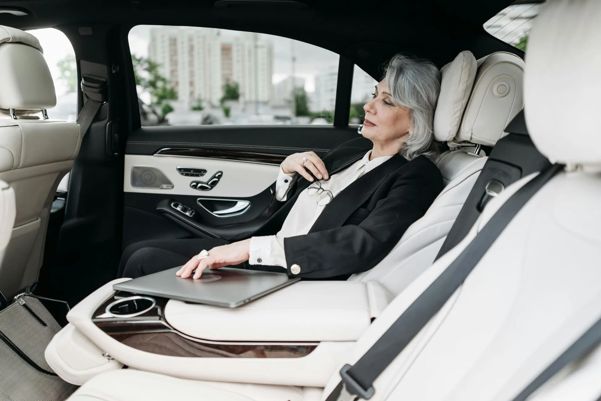 Woman relaxing in luxury car interior