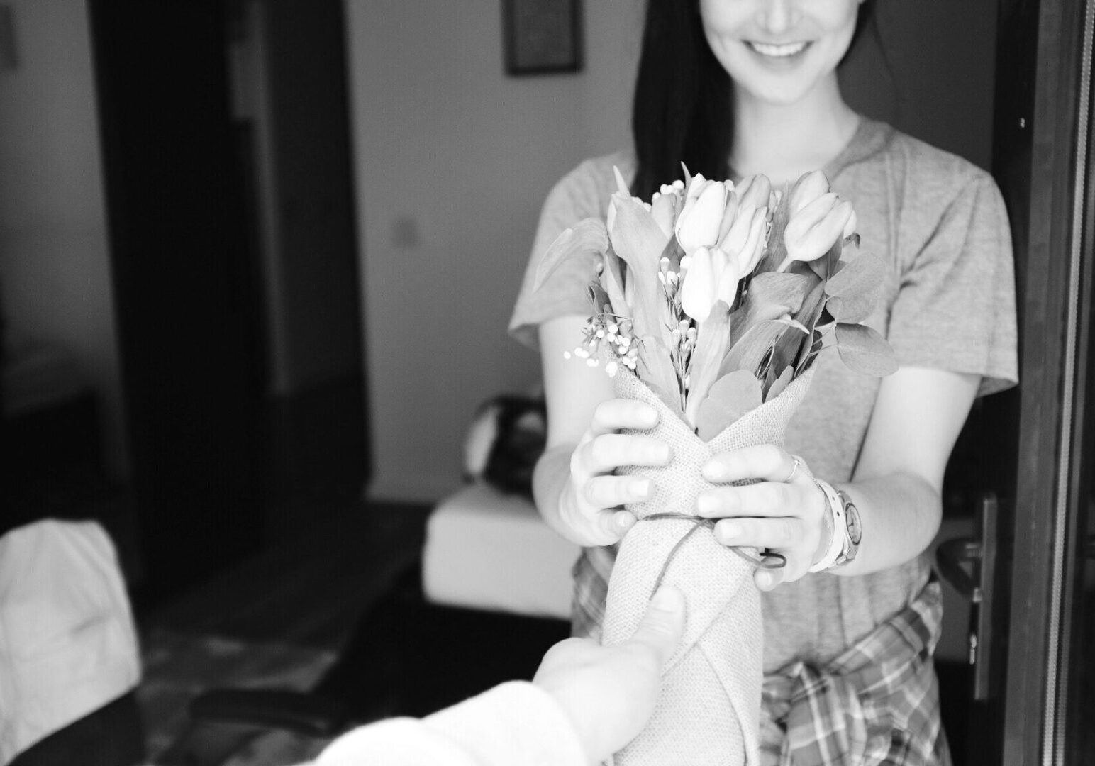 Woman receiving bouquet of flowers
