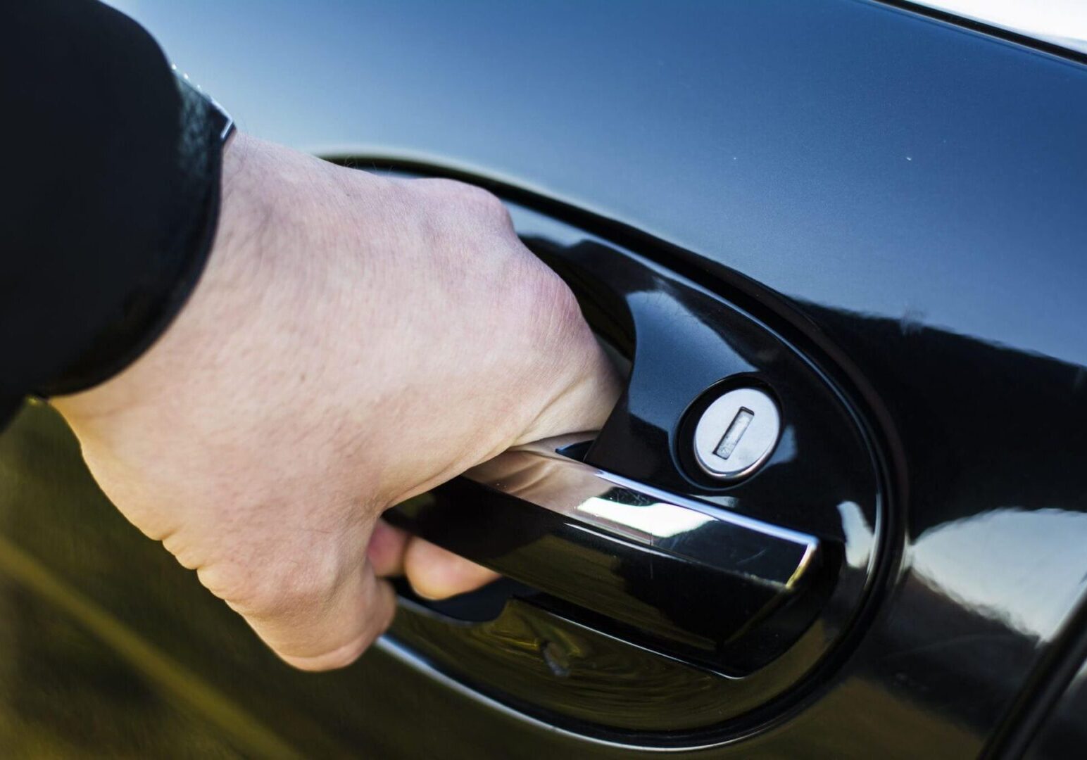 Black car door being opened