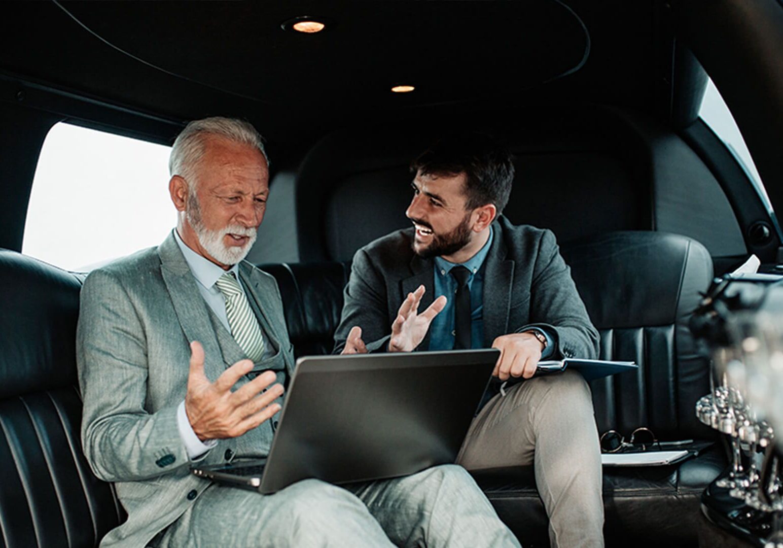 Colleagues having a conversation in vehicle