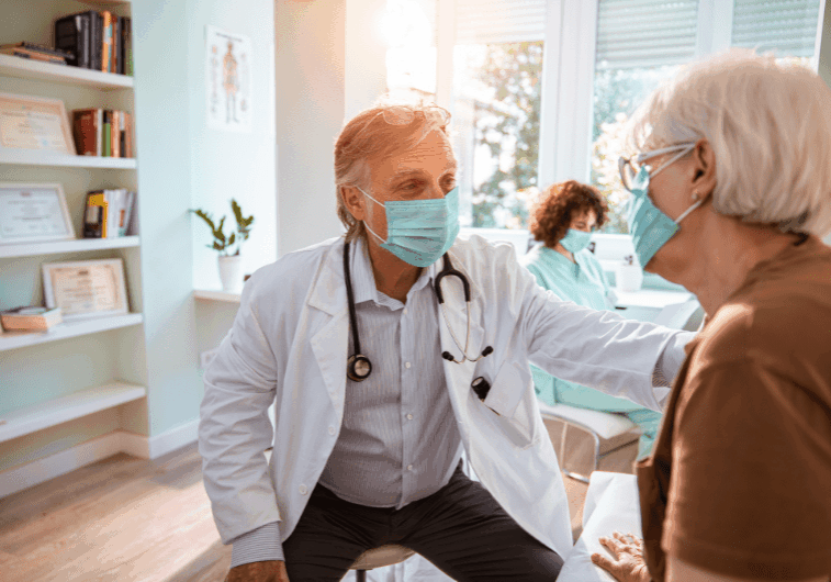 Doctor consulting patient in medical office